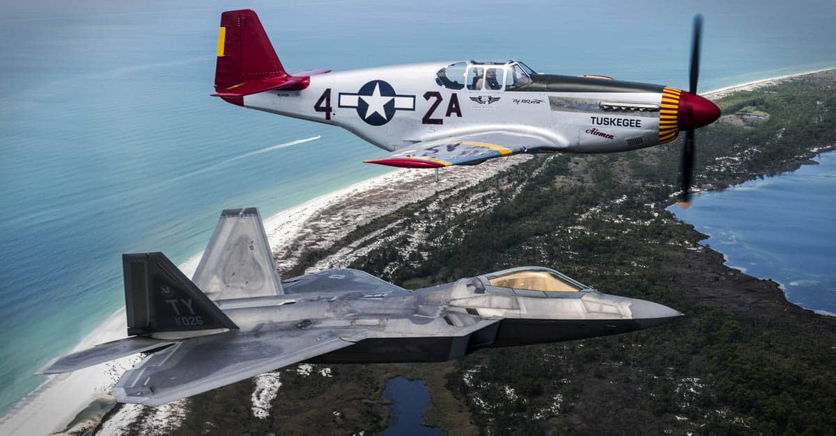 P-51- An Air Force F-22 Raptor flies in formation with a World War II-era P-51 Mustang over Panama City Beach, Fla